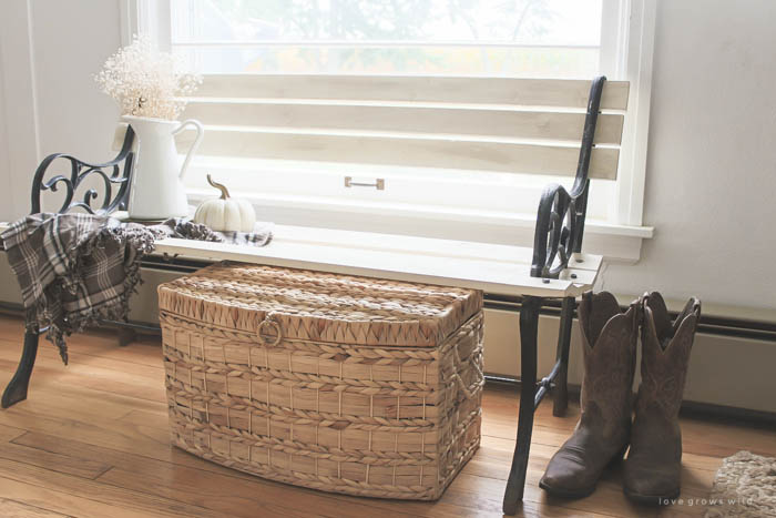 Check out this trash to treasure transformation! An old wood and cast iron bench is refinished and used in a beautiful farmhouse entryway. See photos at LoveGrowsWild.com