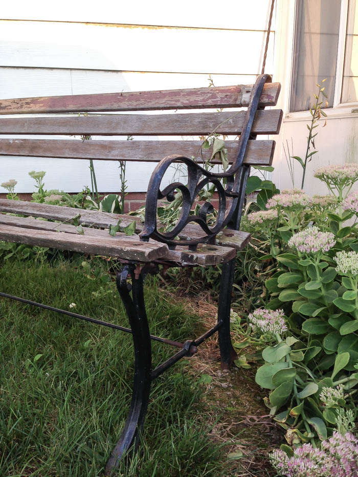 Check out this trash to treasure transformation! An old wood and cast iron bench is refinished and used in a beautiful farmhouse entryway. See photos at LoveGrowsWild.com