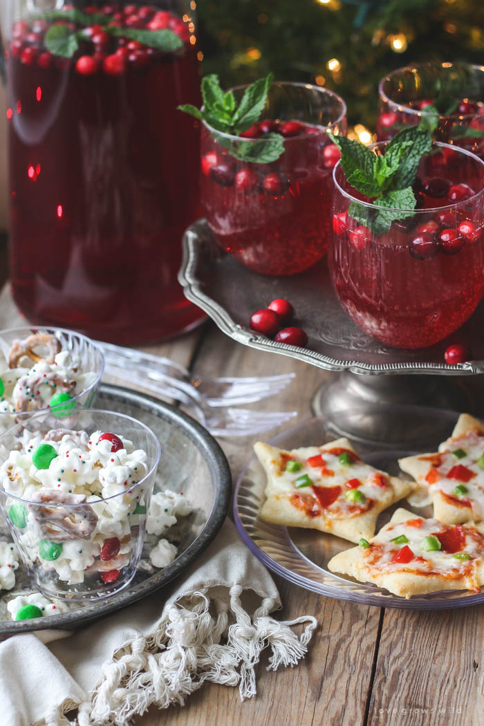 Host a holiday movie night this year! Serve these easy, festive treats during the movie: White Chocolate Popcorn Mix, Cookie Cutter Mini Pizzas, Cranberry Holiday Punch. | Recipes at LoveGrowsWild.com 