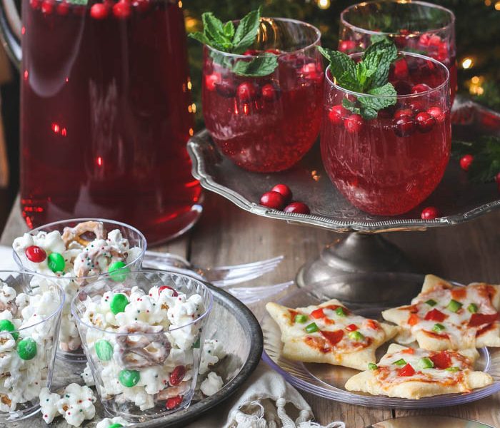 Host a holiday movie night this year! Serve these easy, festive treats during the movie: White Chocolate Popcorn Mix, Cookie Cutter Mini Pizzas, Cranberry Holiday Punch. | Recipes at LoveGrowsWild.com