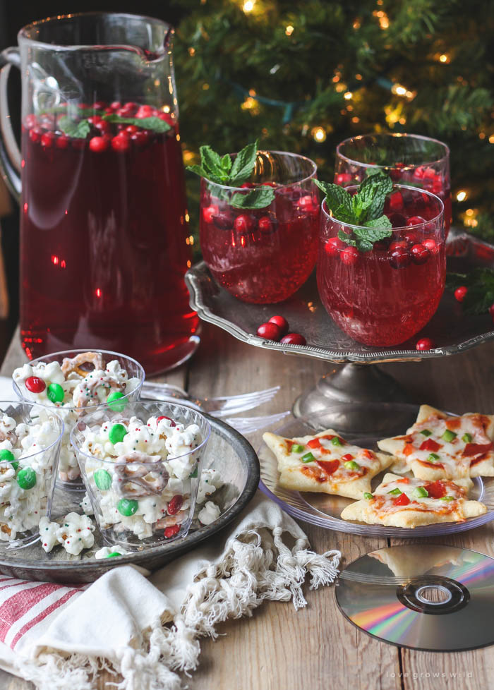 Host a holiday movie night this year! Serve these easy, festive treats during the movie: White Chocolate Popcorn Mix, Cookie Cutter Mini Pizzas, Cranberry Holiday Punch. | Recipes at LoveGrowsWild.com