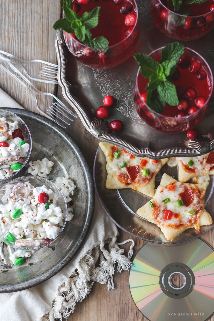 Host a holiday movie night this year! Serve these easy, festive treats during the movie: White Chocolate Popcorn Mix, Cookie Cutter Mini Pizzas, Cranberry Holiday Punch. | Recipes at LoveGrowsWild.com 