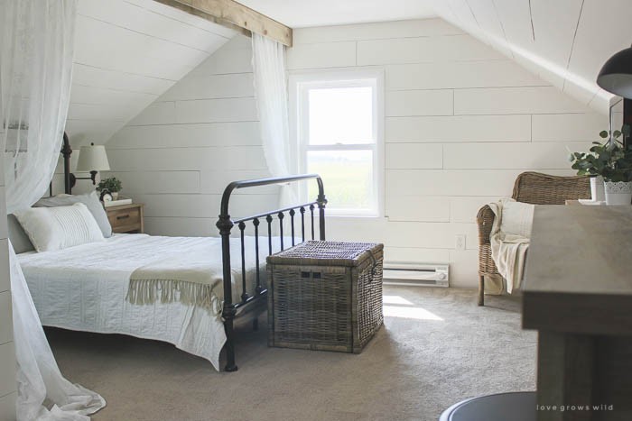 Lots of stylish, affordable furniture options in this farmhouse master bedroom! Click for more photos and details at LoveGrowsWild.com
