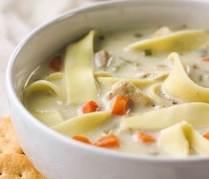 This homemade Creamy Chicken Noodle Soup is easy to make and so comforting! Get the recipe for this super creamy homemade soup at LoveGrowsWild.com