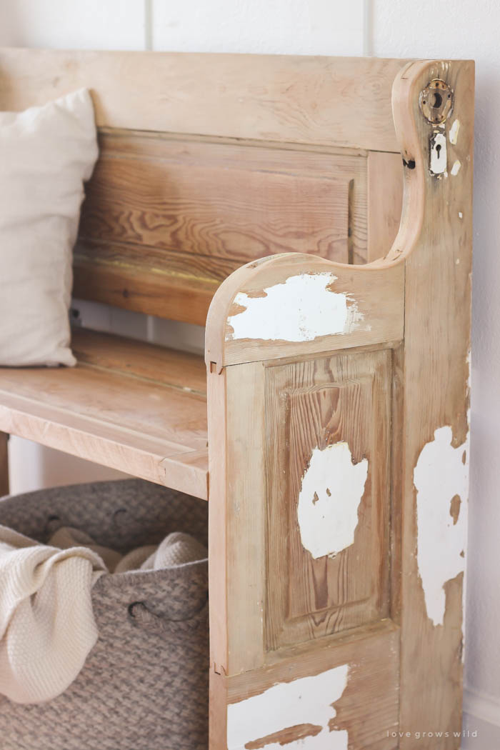 See how an old wood door transforms into a gorgeous, rustic bench! Get the full tutorial on LoveGrowsWild.com