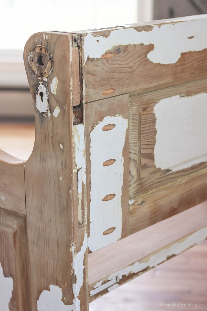 See how an old wood door transforms into a gorgeous, rustic bench! Get the full tutorial on LoveGrowsWild.com