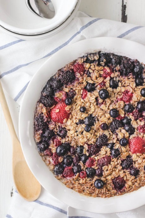Enjoy a bowl of this warm, delicious Triple Berry Baked Oatmeal for breakfast! Easy to make and baked right in the oven... perfect for serving a crowd! | LoveGrowsWild.com
