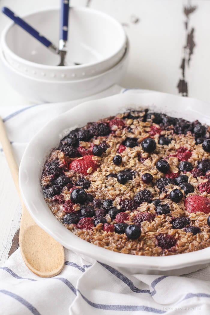 Enjoy a bowl of this warm, delicious Triple Berry Baked Oatmeal for breakfast! Easy to make and baked right in the oven... perfect for serving a crowd! | LoveGrowsWild.com