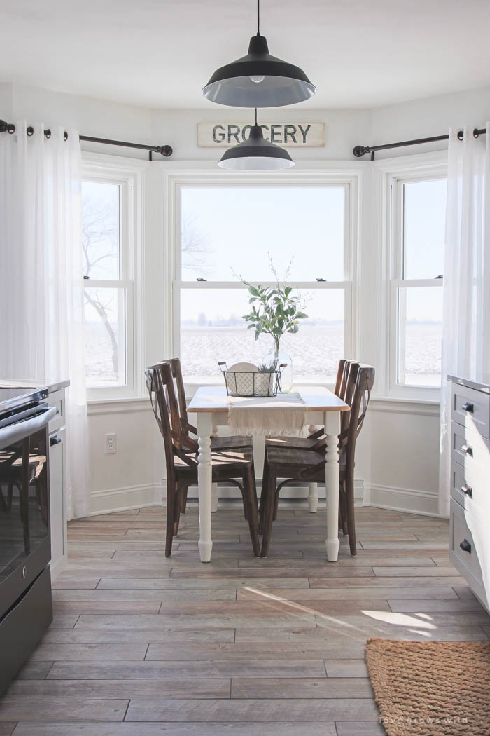 This Indiana farmhouse just got a BIG kitchen makeover! Click to see more photos and sources for this gorgeous space at LoveGrowsWild.com