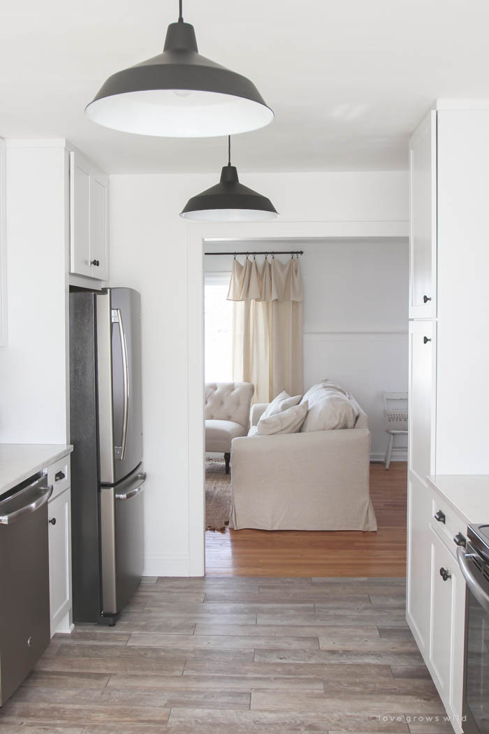 Follow along the makeover of this beautiful farmhouse kitchen! In this post, Liz shares her tile choice for flooring. Click for more photos and details!