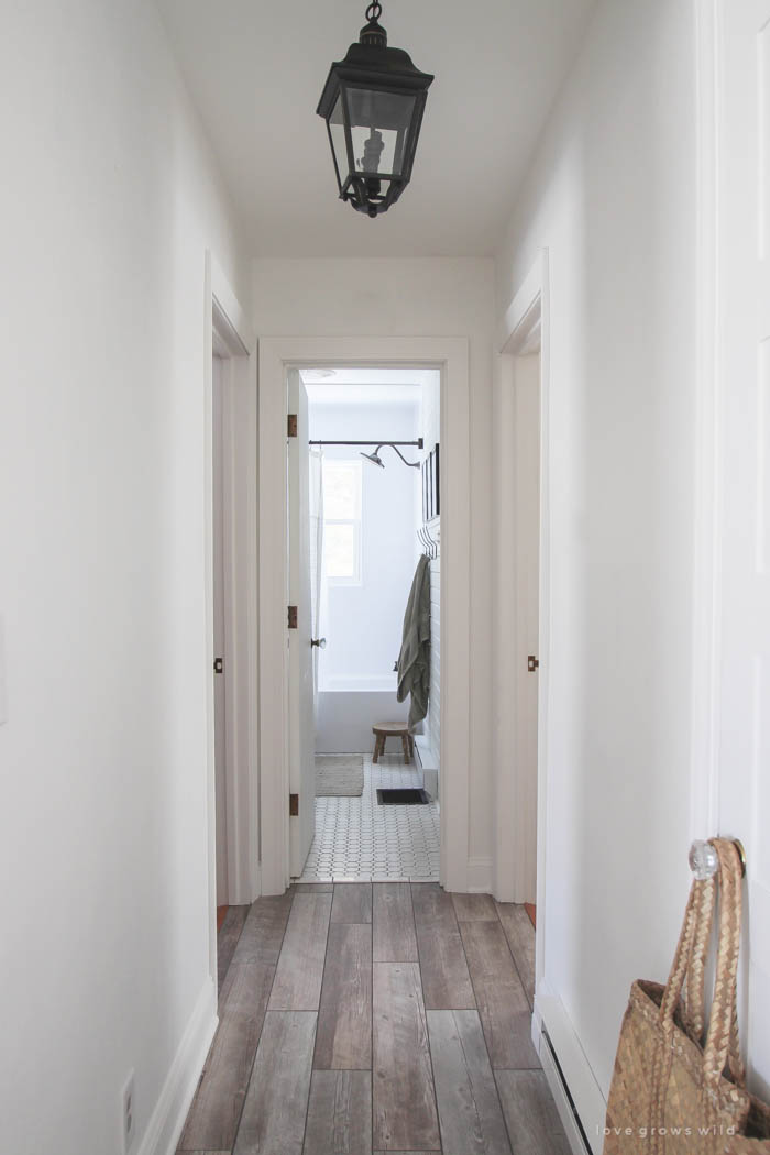 Follow along the makeover of this beautiful farmhouse kitchen! In this post, Liz shares her tile choice for flooring. Click for more photos and details!