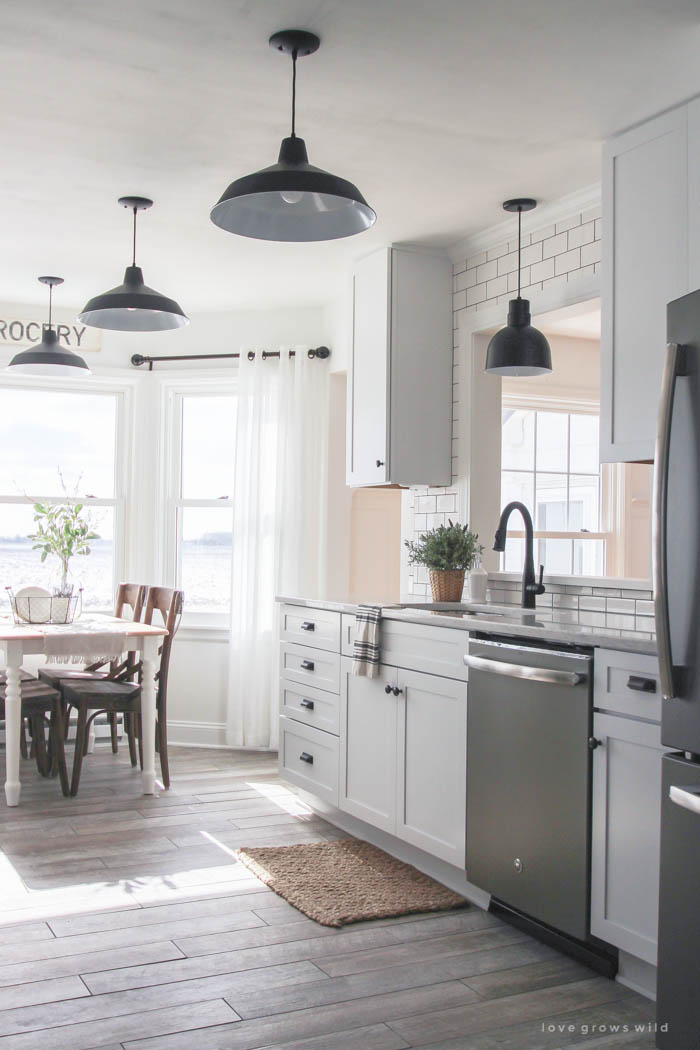 Follow along the makeover of this beautiful farmhouse kitchen! In this post, Liz shares her tile choice for flooring. Click for more photos and details!