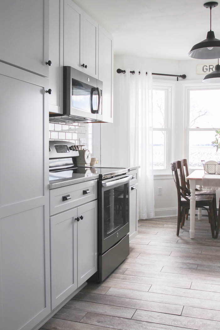 Follow along the makeover of this beautiful farmhouse kitchen! In this post, Liz shares the countertops she picked and why. Click for more photos and details!