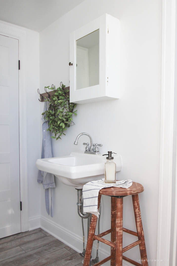 Follow along the makeover of this beautiful farmhouse kitchen! In this post, Liz shares her tile choice for flooring. Click for more photos and details!