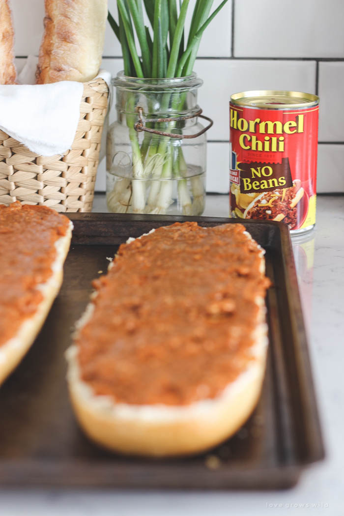 This Toasted Chili Cheese Bread is the perfect quick appetizer and SO delicious! Tons of gooey cheese with a spicy kick of chili! Recipe at LoveGrowsWild.com