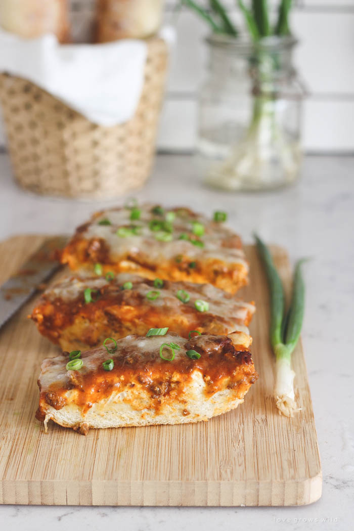 This Toasted Chili Cheese Bread is the perfect quick appetizer and SO delicious! Tons of gooey cheese with a spicy kick of chili! Recipe at LoveGrowsWild.com