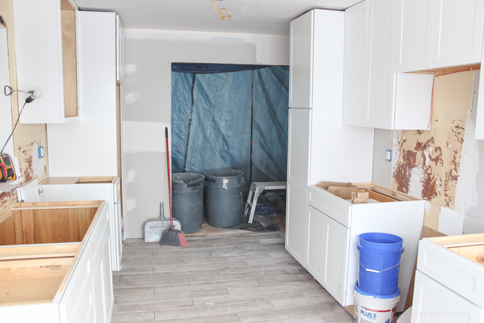 Follow along the makeover of this beautiful farmhouse kitchen! In this post, Liz shares the cabinets and hardware she used. Click for more photos and details!