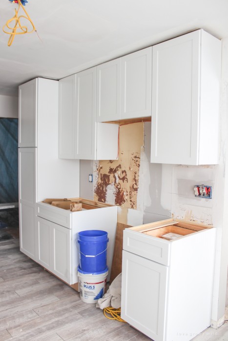 Follow along the makeover of this beautiful farmhouse kitchen! In this post, Liz shares the cabinets and hardware she used. Click for more photos and details!