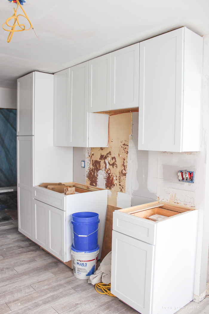 Follow along the makeover of this beautiful farmhouse kitchen! In this post, Liz shares the cabinets and hardware she used. Click for more photos and details!