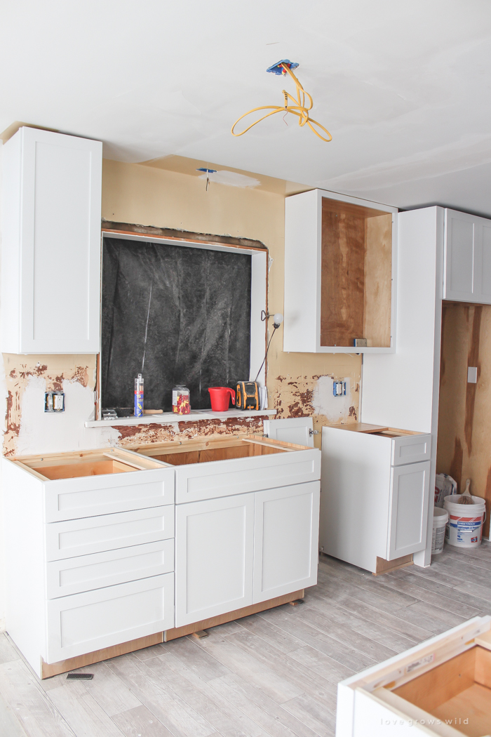 Follow along the makeover of this beautiful farmhouse kitchen! In this post, Liz shares the cabinets and hardware she used. Click for more photos and details!