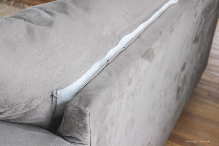 Are your sofa cushions attached to the frame? See how this blogger detached and separated them to prepare her couch for custom slipcovers!