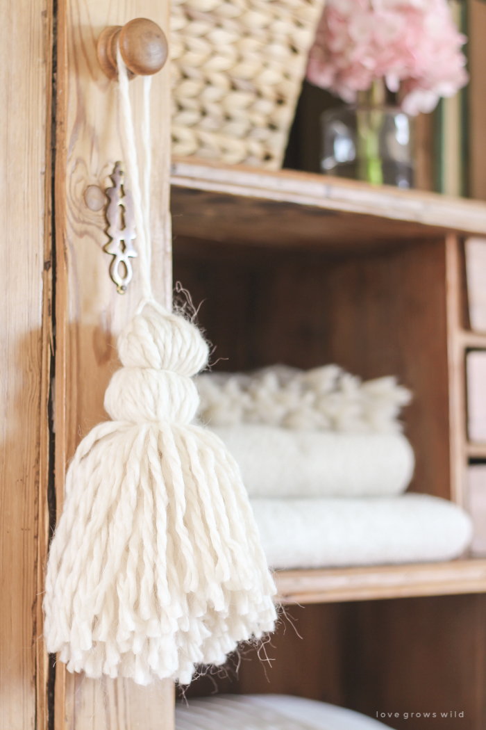 A gorgeous antique armoire decorated for spring in a lovely, little farmhouse. See more photos at LoveGrowsWild.com