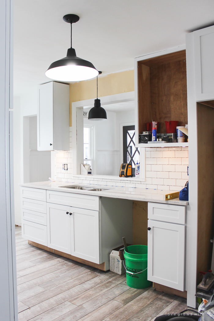 Follow along the makeover of this beautiful farmhouse kitchen! In this post, Liz shares the backsplash she chose and why. Click for more photos and details!