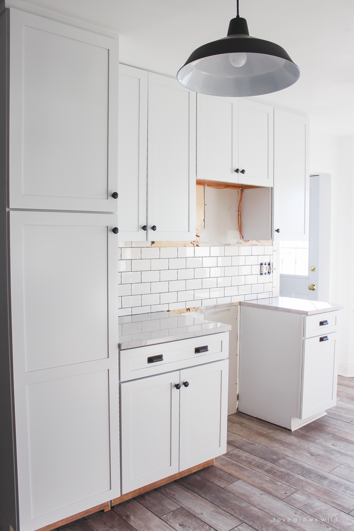 Follow along the makeover of this beautiful farmhouse kitchen! In this post, Liz shares the backsplash she chose and why. Click for more photos and details!