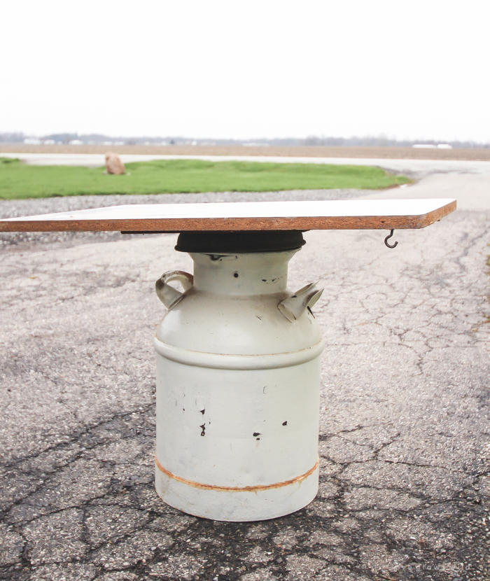 How to turn an old milk can into a gorgeous coffee table! See how this blogger created a unique piece of furniture perfect for her farmhouse at LoveGrowsWild.com 