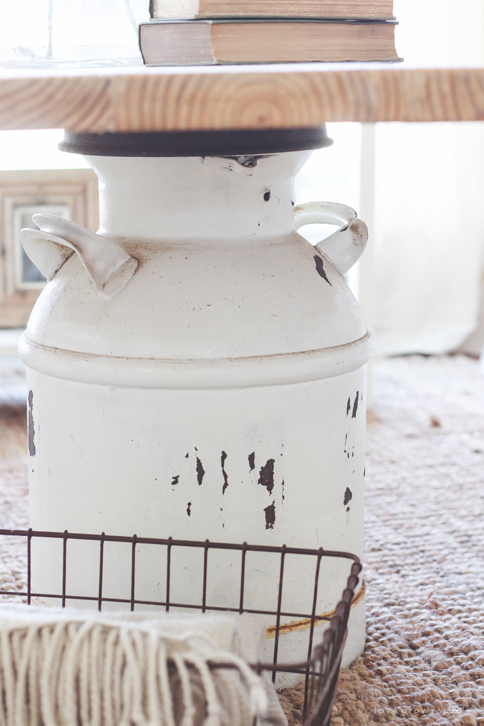 How to turn an old milk can into a gorgeous coffee table! See how this blogger created a unique piece of furniture perfect for her farmhouse at LoveGrowsWild.com 