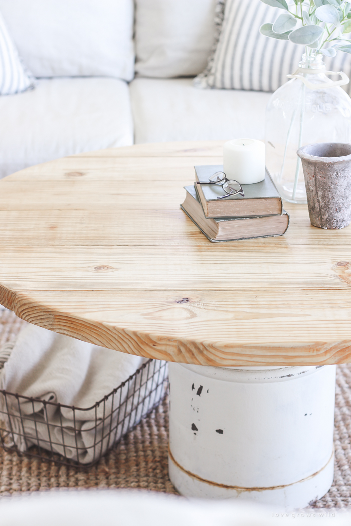 How to turn an old milk can into a gorgeous coffee table! See how this blogger created a unique piece of furniture perfect for her farmhouse at LoveGrowsWild.com 