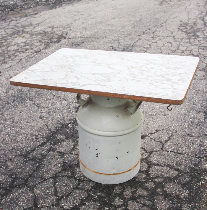 How to turn an old milk can into a gorgeous coffee table! See how this blogger created a unique piece of furniture perfect for her farmhouse at LoveGrowsWild.com 