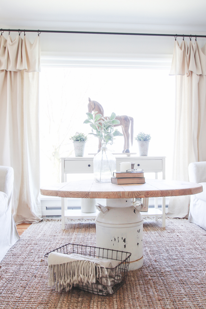 How to turn an old milk can into a gorgeous coffee table! See how this blogger created a unique piece of furniture perfect for her farmhouse at LoveGrowsWild.com 