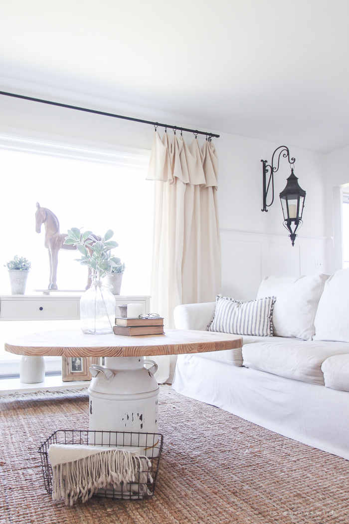 How to turn an old milk can into a gorgeous coffee table! See how this blogger created a unique piece of furniture perfect for her farmhouse at LoveGrowsWild.com 