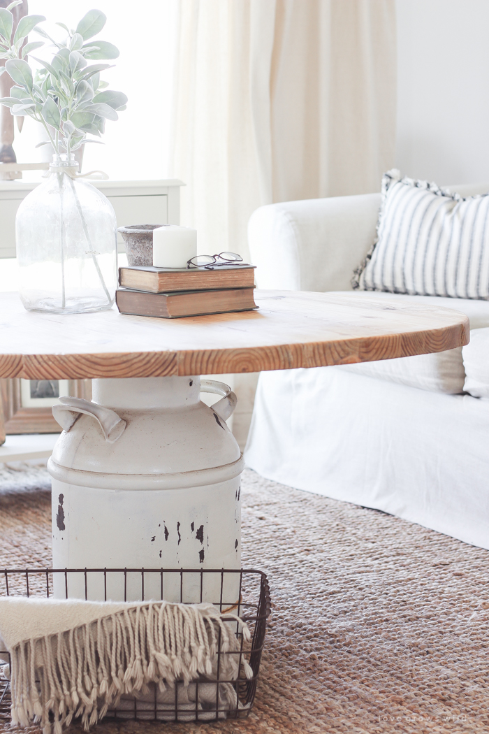 How to turn an old milk can into a gorgeous coffee table! See how this blogger created a unique piece of furniture perfect for her farmhouse at LoveGrowsWild.com 