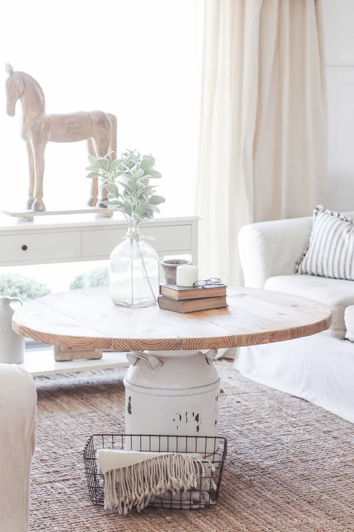 How to turn an old milk can into a gorgeous coffee table! See how this blogger created a unique piece of furniture perfect for her farmhouse at LoveGrowsWild.com