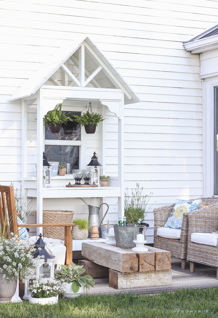 This stunning DIY potting bench is full of charm and perfect for a deck or patio! Use it to hold pots and gardening tools or as a beverage cart when entertaining guests! Full how-to at LoveGrowsWild.com