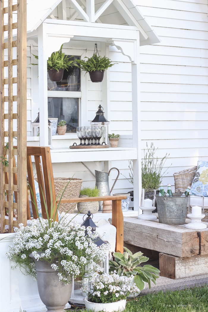 This stunning DIY potting bench is full of charm and perfect for a deck or patio! Use it to hold pots and gardening tools or as a beverage cart when entertaining guests! Full how-to at LoveGrowsWild.com