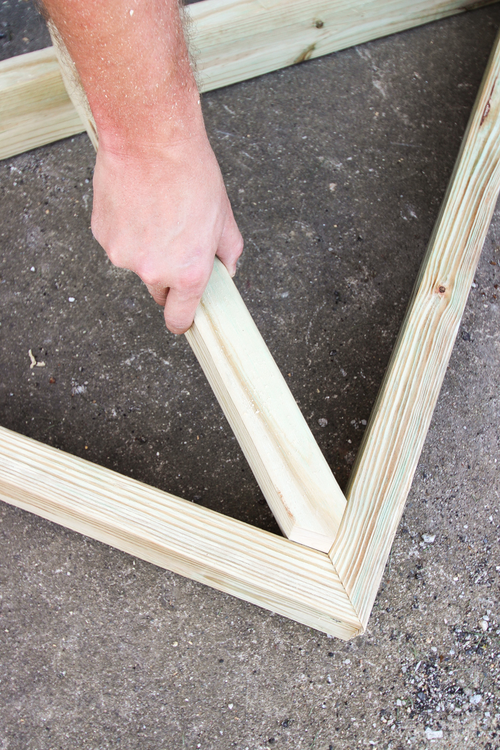 This stunning DIY potting bench is full of charm and perfect for a deck or patio! Use it to hold pots and gardening tools or as a beverage cart when entertaining guests! Full how-to at LoveGrowsWild.com