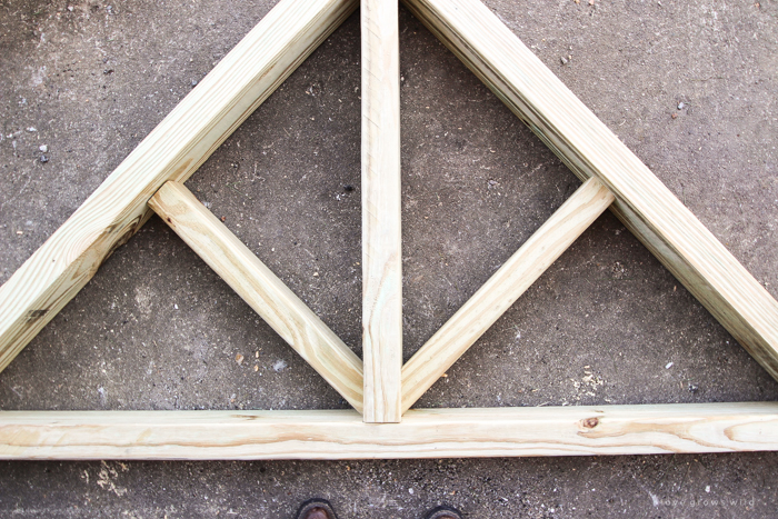 This stunning DIY potting bench is full of charm and perfect for a deck or patio! Use it to hold pots and gardening tools or as a beverage cart when entertaining guests! Full how-to at LoveGrowsWild.com