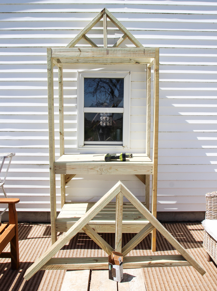 This stunning DIY potting bench is full of charm and perfect for a deck or patio! Use it to hold pots and gardening tools or as a beverage cart when entertaining guests! Full how-to at LoveGrowsWild.com