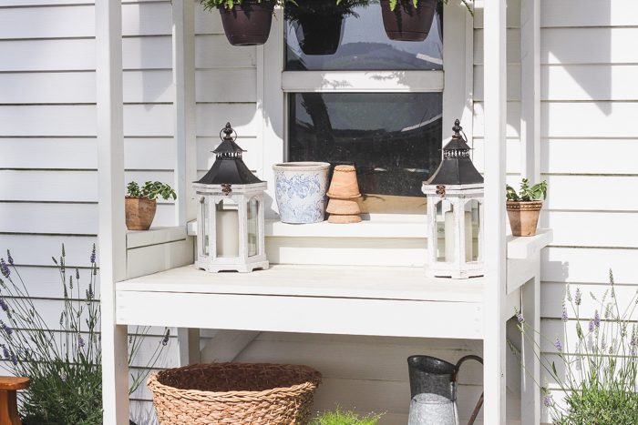 This stunning DIY potting bench is full of charm and perfect for a deck or patio! Use it to hold pots and gardening tools or as a beverage cart when entertaining guests! Full how-to at LoveGrowsWild.com