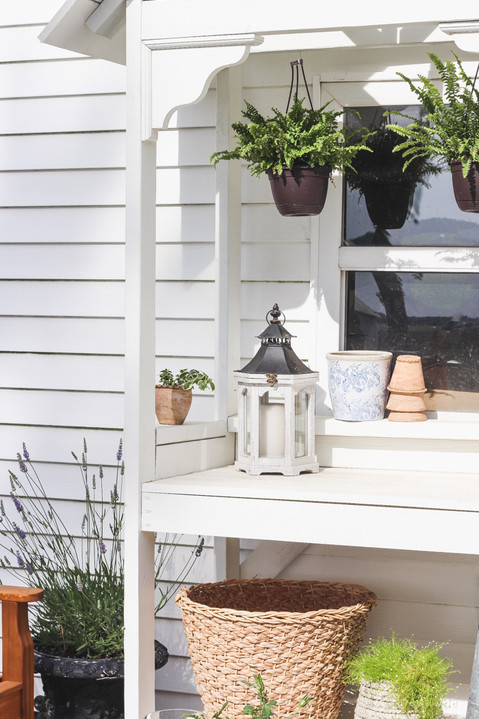 This stunning DIY potting bench is full of charm and perfect for a deck or patio! Use it to hold pots and gardening tools or as a beverage cart when entertaining guests! Full how-to at LoveGrowsWild.com