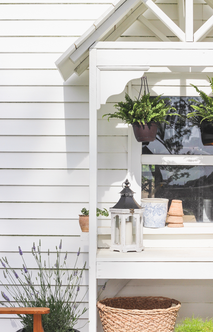 This stunning DIY potting bench is full of charm and perfect for a deck or patio! Use it to hold pots and gardening tools or as a beverage cart when entertaining guests! Full how-to at LoveGrowsWild.com