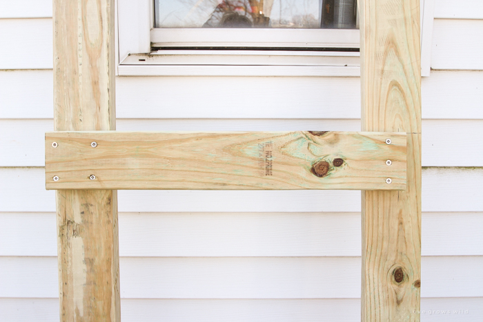 This stunning DIY potting bench is full of charm and perfect for a deck or patio! Use it to hold pots and gardening tools or as a beverage cart when entertaining guests! Full how-to at LoveGrowsWild.com