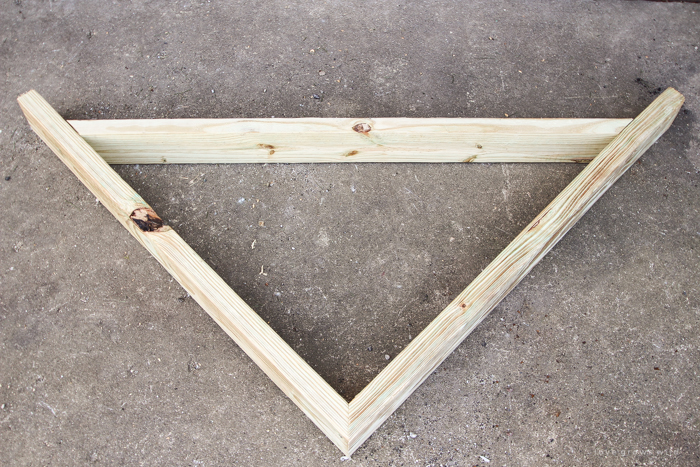 This stunning DIY potting bench is full of charm and perfect for a deck or patio! Use it to hold pots and gardening tools or as a beverage cart when entertaining guests! Full how-to at LoveGrowsWild.com