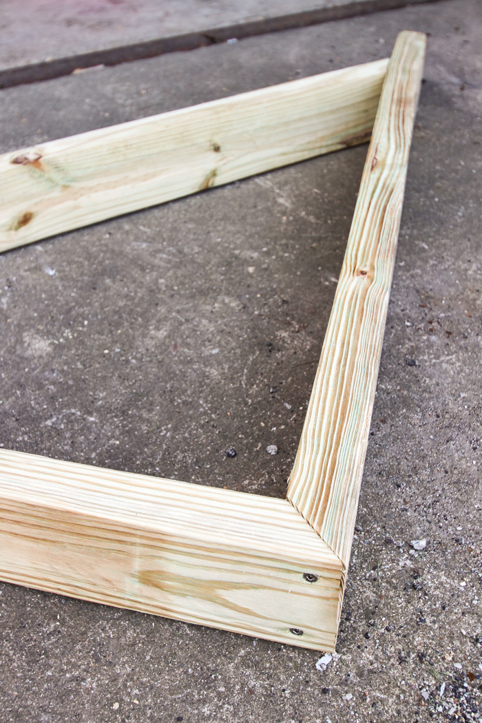 This stunning DIY potting bench is full of charm and perfect for a deck or patio! Use it to hold pots and gardening tools or as a beverage cart when entertaining guests! Full how-to at LoveGrowsWild.com