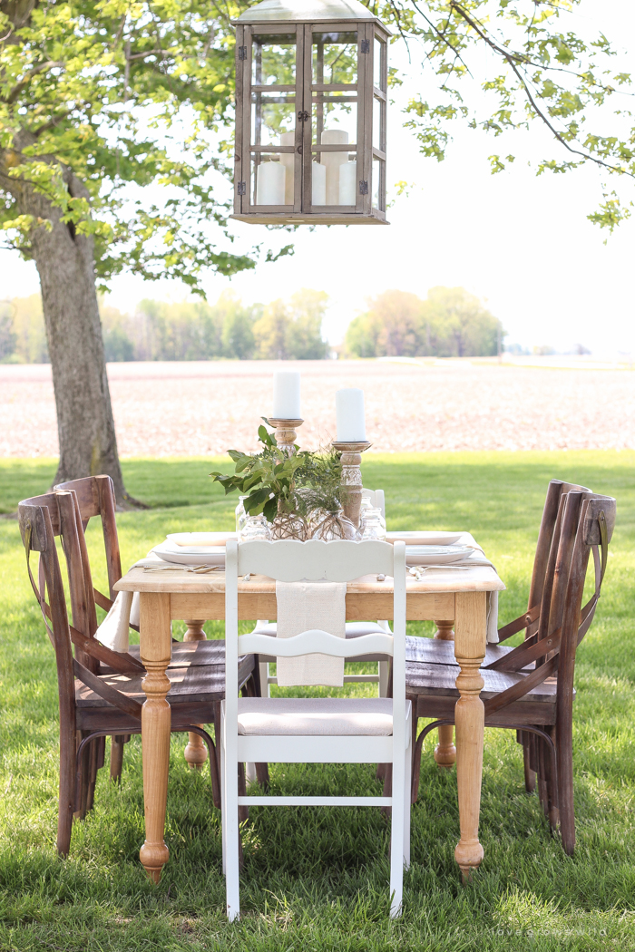 Learn how to create the perfect outdoor table setting with shopping and decorating tips from Liz Fourez. This view of her farm is stunning!