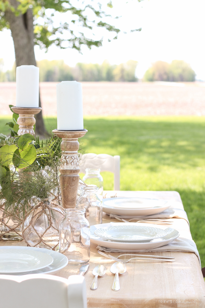 Learn how to create the perfect outdoor table setting with shopping and decorating tips from Liz Fourez. This view of her farm is stunning!