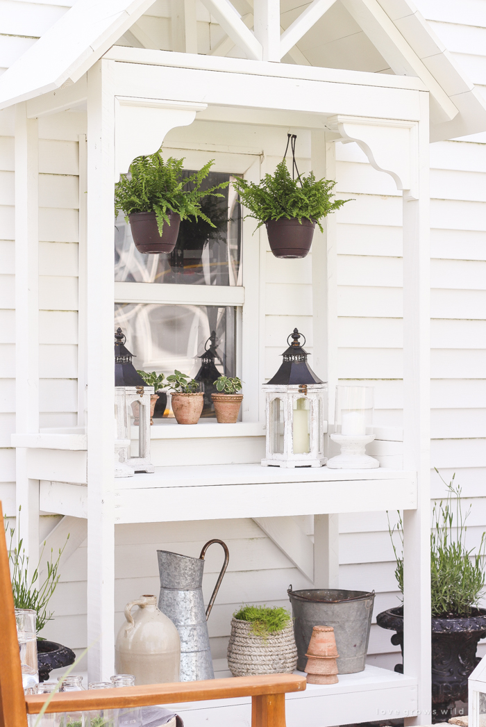 A boring, bare patio turned into a gorgeous outdoor entertaining area! See the incredible before and after of this beautiful patio makeover! 